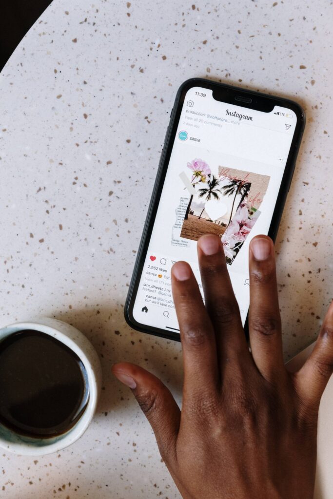 woman using instagram on her phone drinking coffee